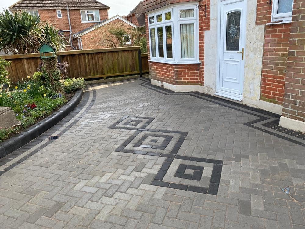Grey block paving driveway with decorative inlay, Plymouth